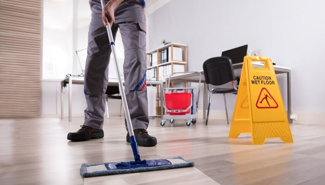 Picture of janitor mopping floor