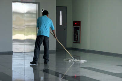 Picture of janitor mopping