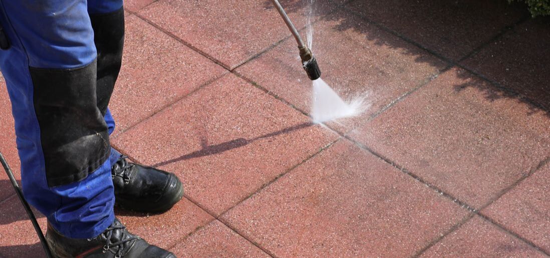 Picture of person pressure washing